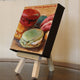 Original art for sale at UGallery.com | Assorted Macaroons by Jonelle Summerfield | $75 | oil painting | 4' h x 4' w | thumbnail 2
