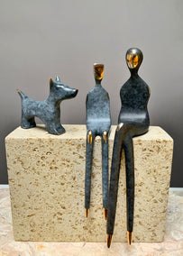 sculpture by Yenny Cocq titled Mother and Child with Dog